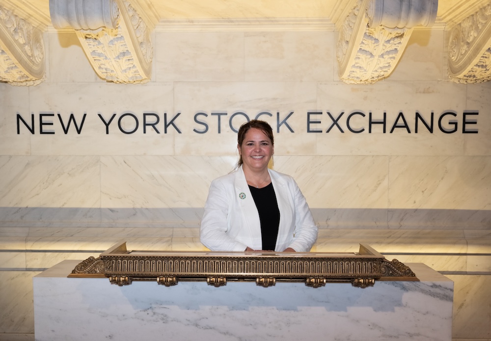 Woman standing in front of NYSE sign